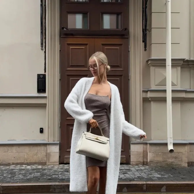 White women's sweater cardigan jacket with extended length and loose fit