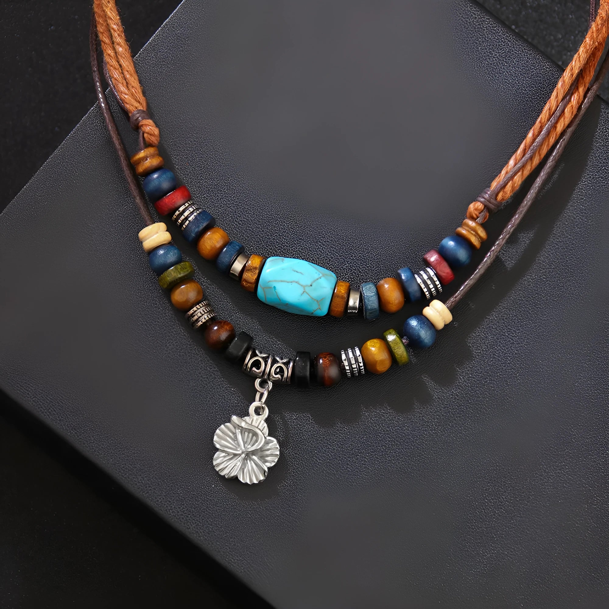 Wooden bead necklace with alloy floral pendant and turquoise wax rope in retro design