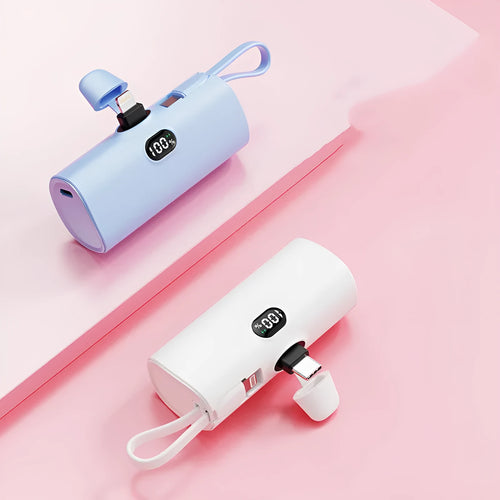 Capsule-shaped digital display power bank with folding plug in multiple colours.