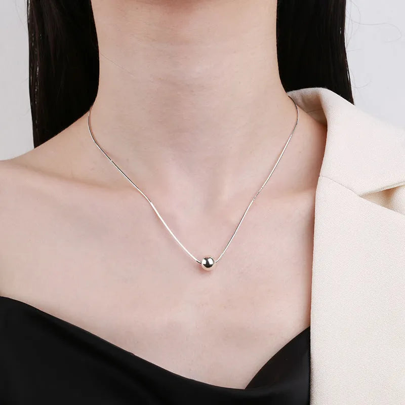 Small spherical pendant silver clavicle chain necklace with round elements and 925 sterling silver construction