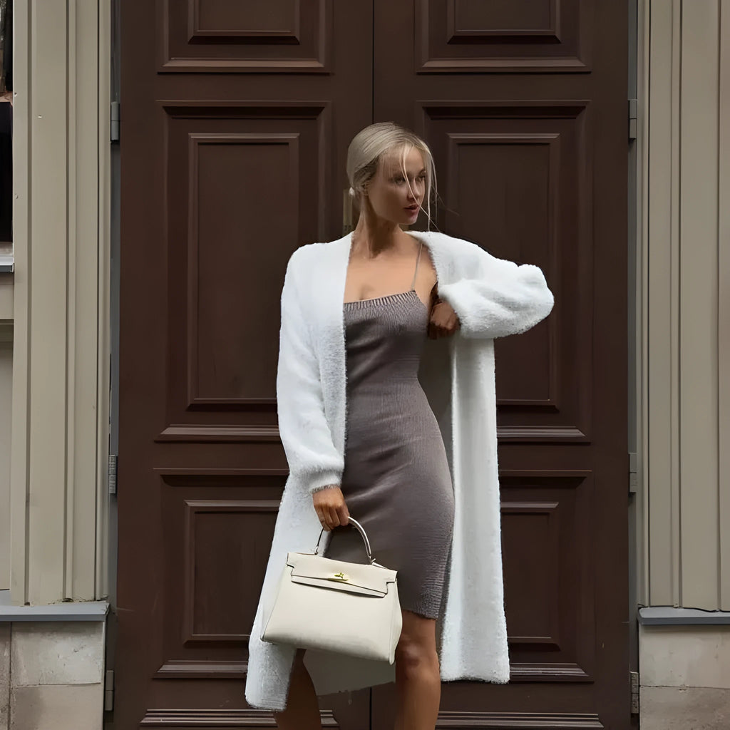 White women's sweater cardigan jacket with extended length and loose fit
