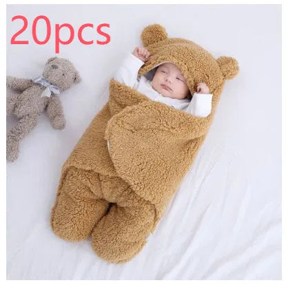 A baby quilted sleeping bag wrapper in a plain colour, showing its quilted pattern and soft cotton blend fabric.