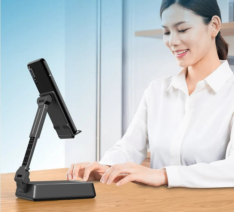 Black mobile phone smart broadcaster stand with Bluetooth speaker and HD mic on a desk