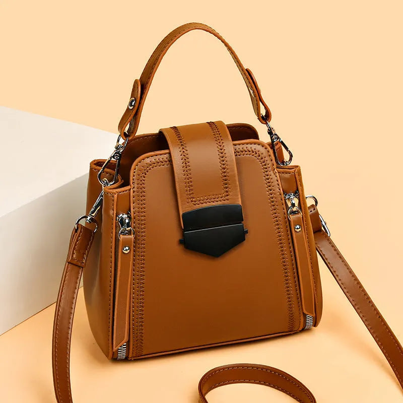 Square vertical PU leather handbag with textured finish and sewing thread detail in colour options