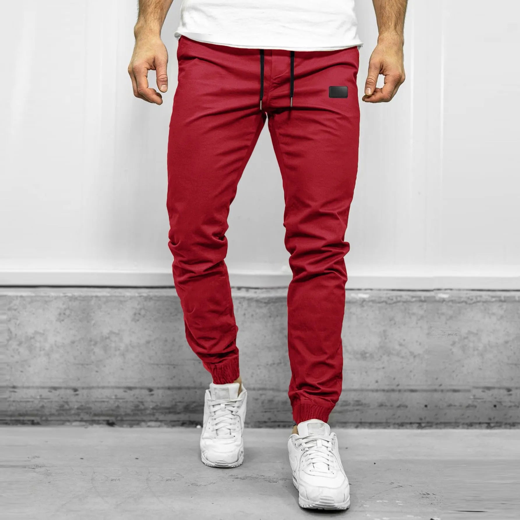 Loose fit quick-dry running trousers in polyester nylon blend, available in four colours and sizes M to XXXL