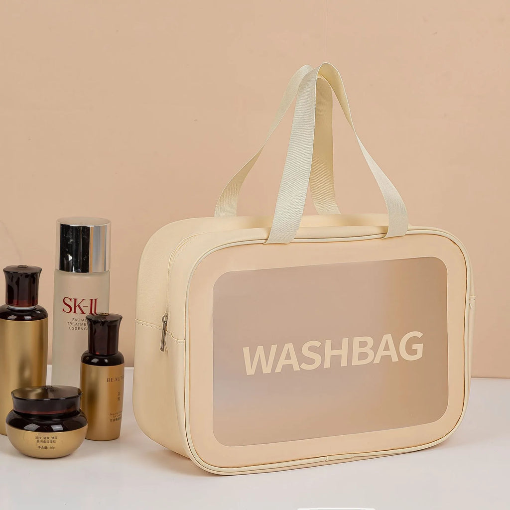 Large PVC transparent cosmetic bag three-piece set in various colours including beige, black, blue, pink, and white, empty and open on a flat surface