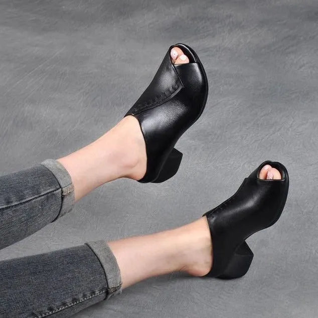 Women's black square heel peep-toe slippers showing fish mouth scaffold design and rubber sole