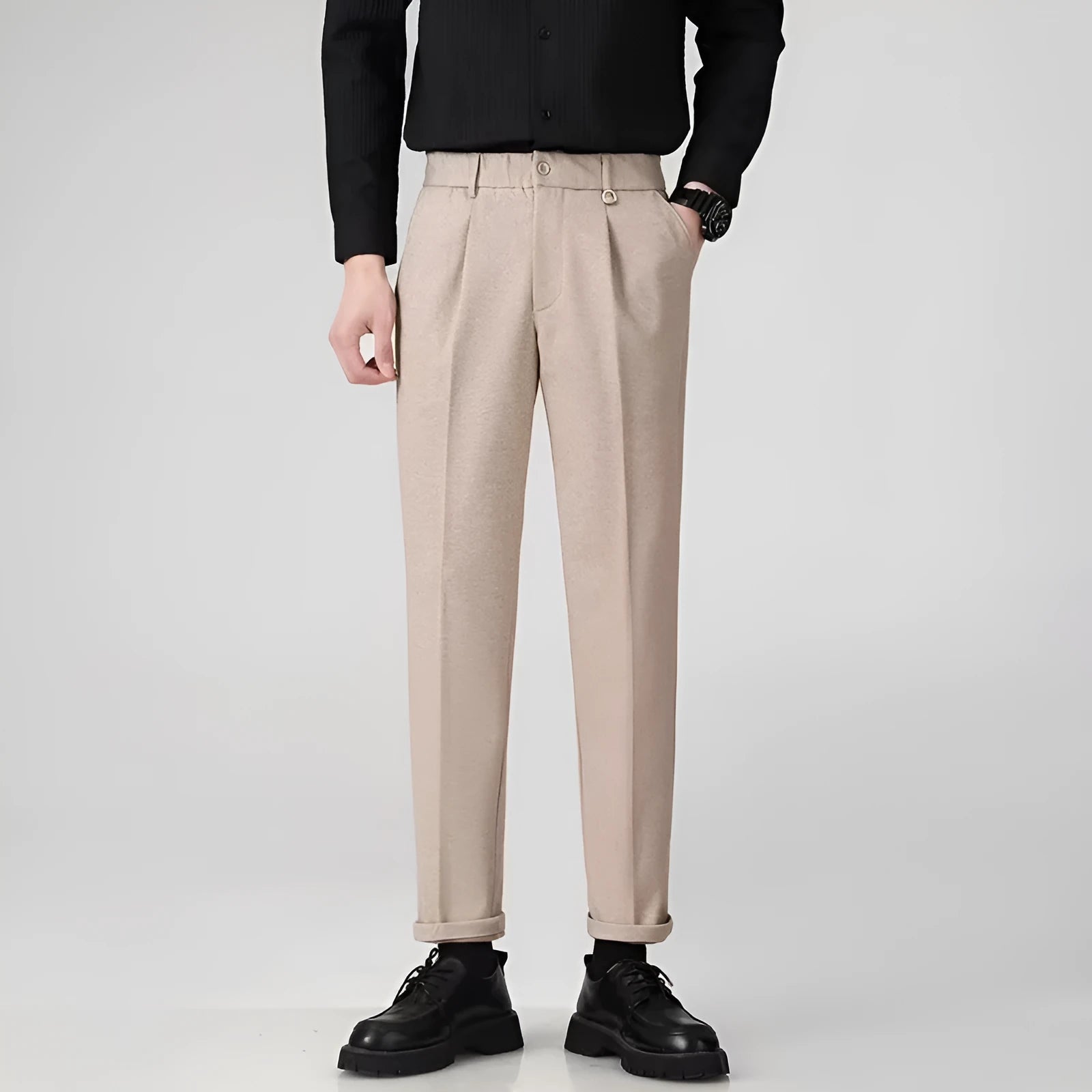 Men's straight-leg casual trousers in draped design, shown in a neutral colour on a hanger.