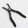 Red round nail removal pliers with adjustable steel jaws and black PVC handles.