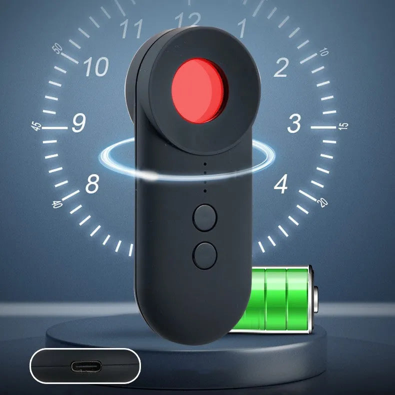 Black portable camera and GPS signal detector with USB charging port on a flat surface.