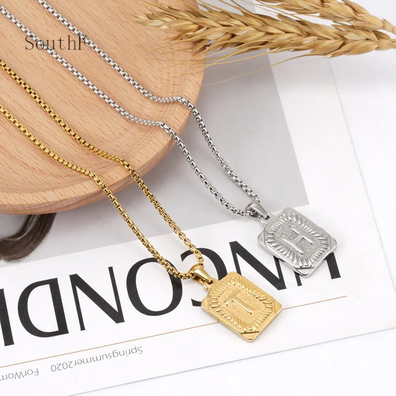 Gold-plated 18K titanium steel letter pendant necklace with pearl chain, unisex, letter M shown.