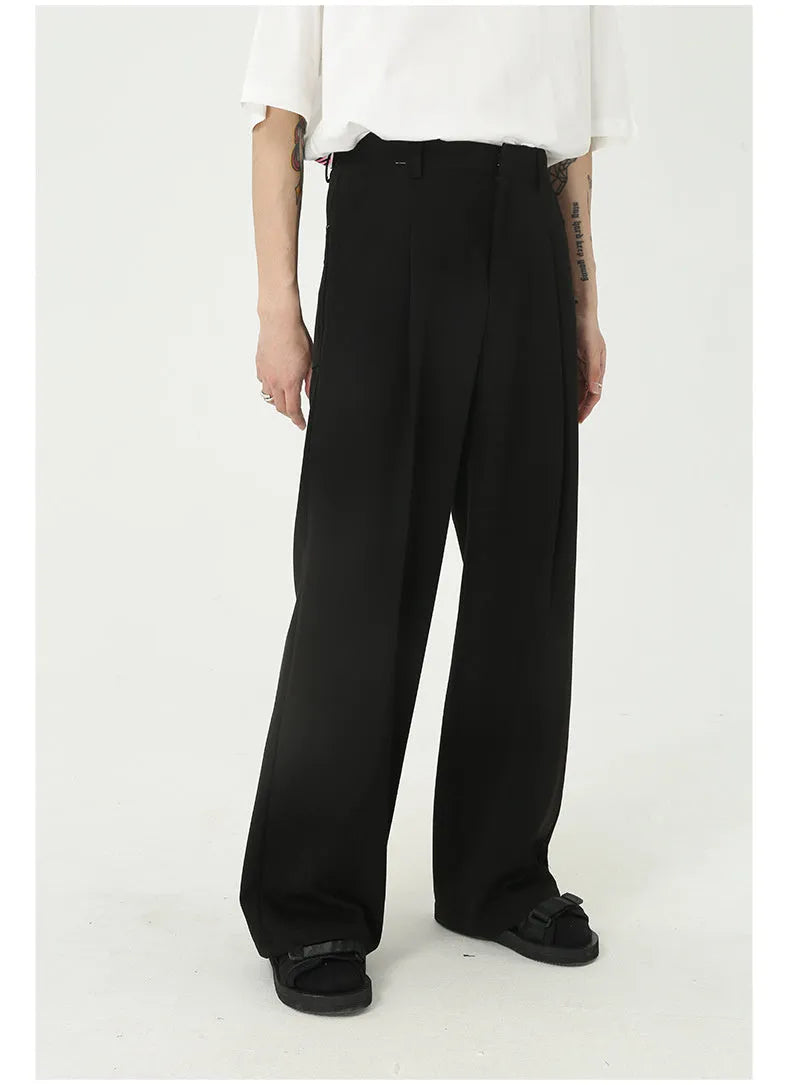 Men's straight mid-waist suit pants in black polyester blend, lying flat, showing straight leg cut and mid-rise waistband.