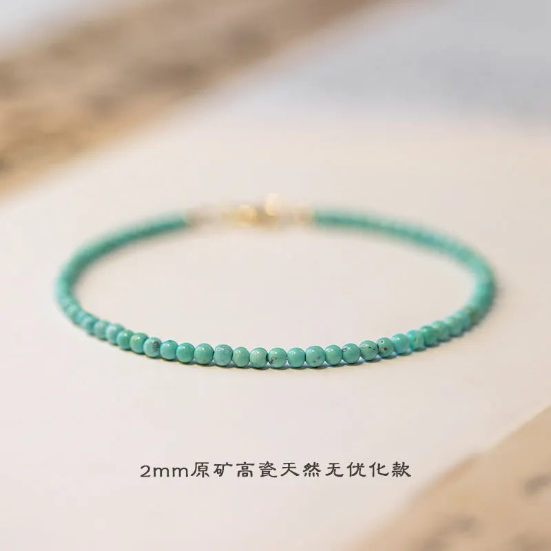Close-up of a geometric bracelet made from small 2mm turquoise beads, shown in both raw and polished finishes, with a sizing chart for 14cm, 15cm, and 16cm wrists.