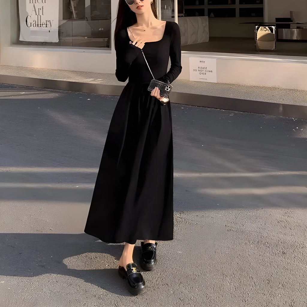 Black square collar knitted A-line dress with elastic waist and long sleeves on a model