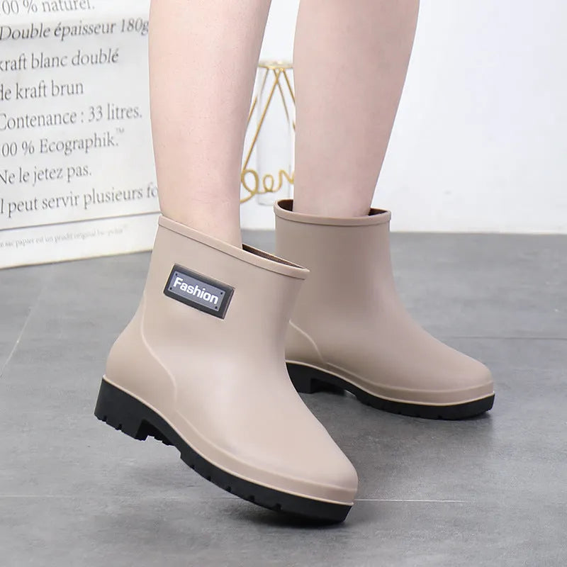 Women's mid-calf PVC rain boots in apricot colour with a low heel for wet weather.