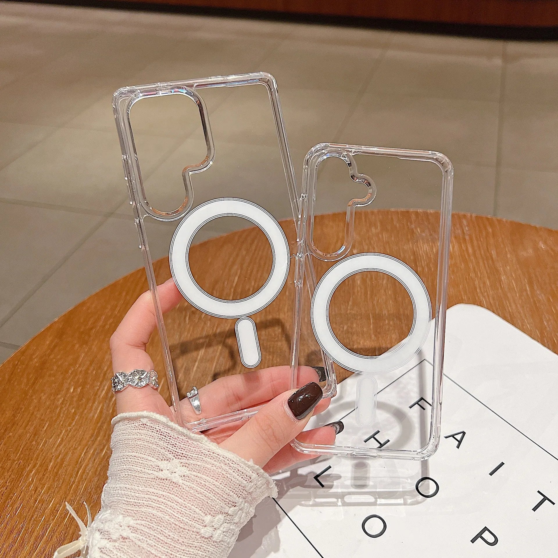 Clear magnetic silicone phone case on a Samsung smartphone showing transparent design and all-inclusive coverage.
