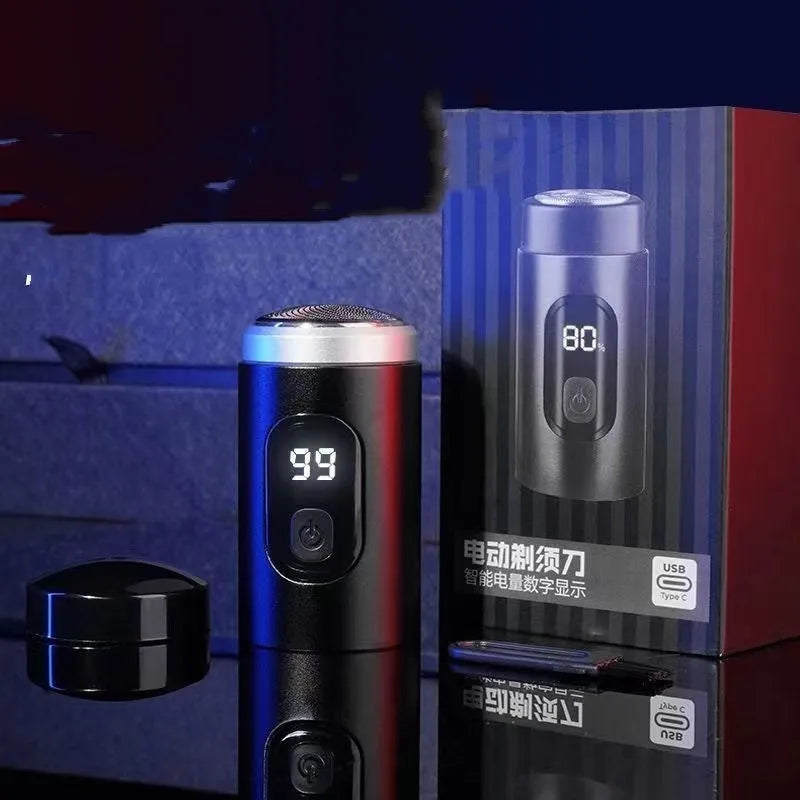 Black mini portable electric shaver with USB charging cable and cleaning brush.