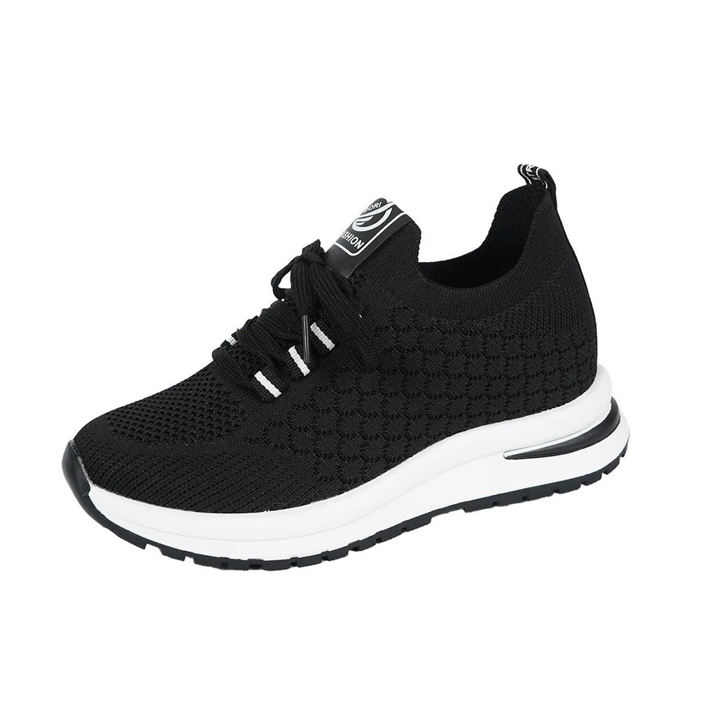 Women's black mesh lace-up flat pumps with round toe and rubber sole on white background