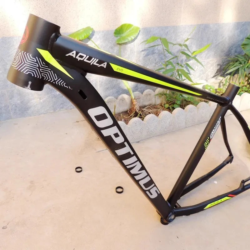 Black Green 29-inch aluminium mountain bike frame showing disc brake mounts and internal cable routing ports.
