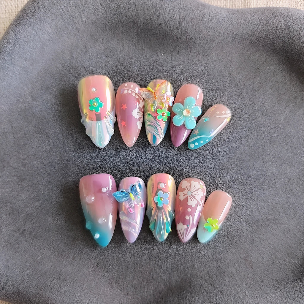 Handmade small flower and butterfly nail art charms in assorted sizes for gel manicure decoration.