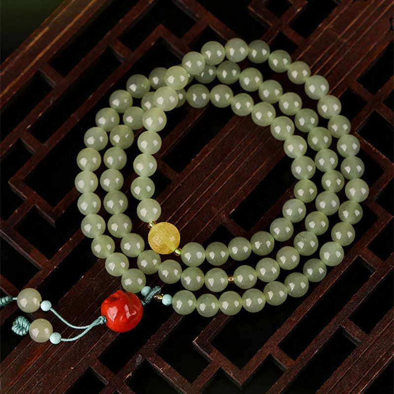 Pale blue Hetian jade bracelet with 6mm beads in three circle pattern