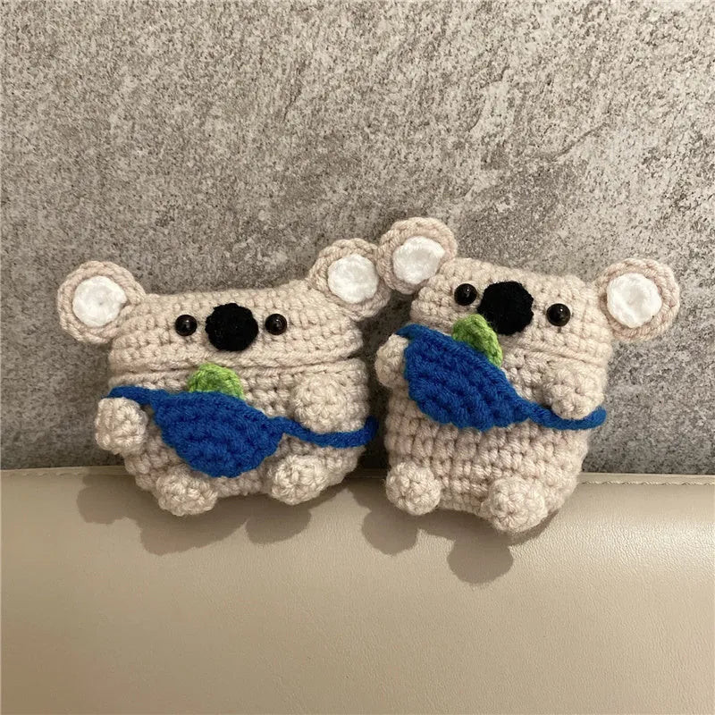Hand knitted AirPods protective sleeve with koala bear backpack design on Apple AirPods case