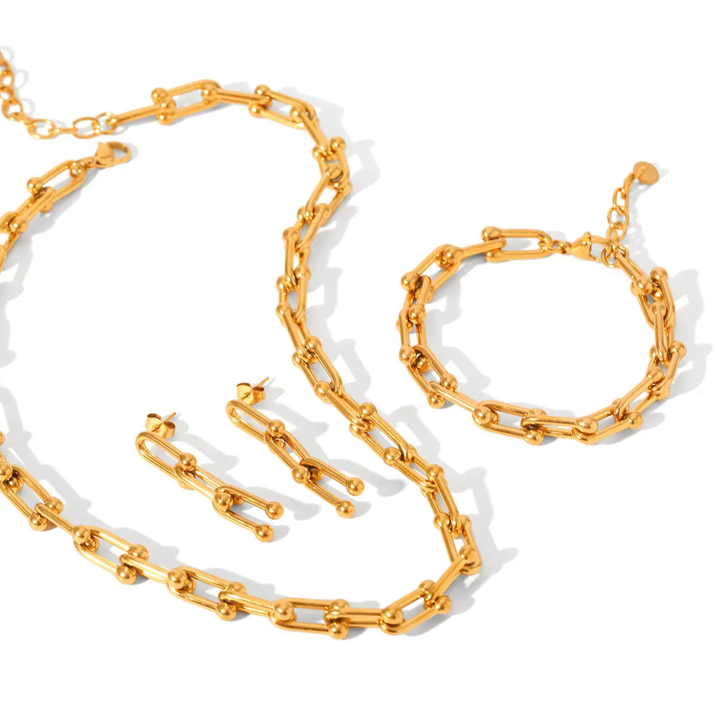 Stainless steel horseshoe charm jewellery set showing necklace, bracelet, and earrings with titanium steel pendants on a regular chain.