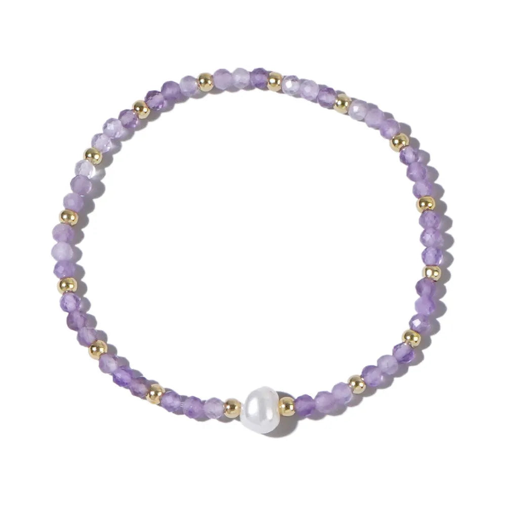 Close-up of a unisex natural stone bracelet with geometric ellipse beads on a wrist.