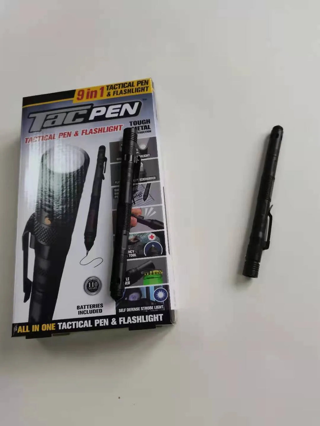 Nine-in-one multi-function flashlight survival pen in black with car window breaker feature