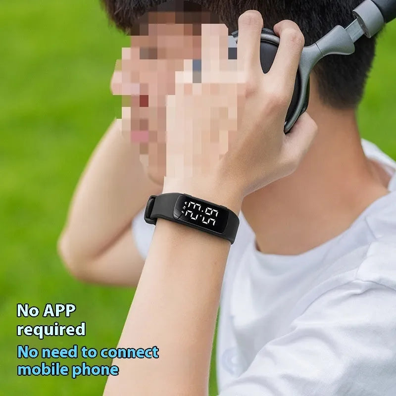 Waterproof vibration alarm watch with LED display and coloured silicone strap on a wrist.