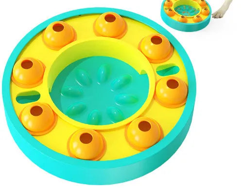 Square blue interactive dog puzzle bowl with a central feeding column and a turntable lid on a wooden floor.