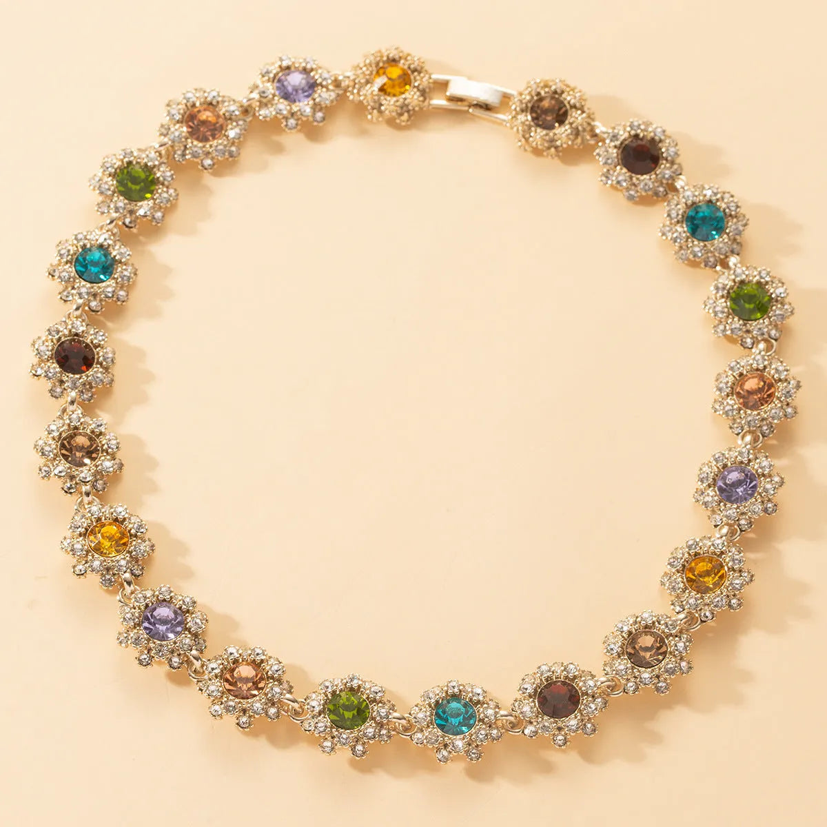 Colorful rhinestone necklace, earrings, and bracelet set on display, electroplated zinc alloy, geometric pendant