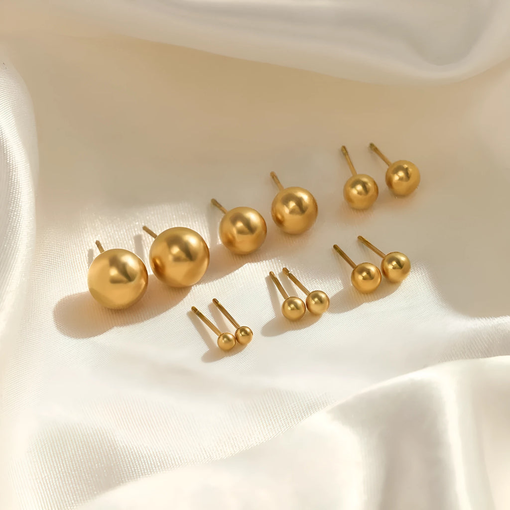 Simple stainless steel stud earrings geometric sphere design available in gold and steel colours multiple sizes