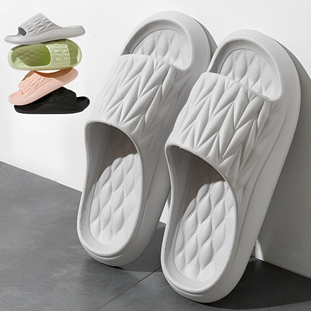 Leaf texture design EVA slippers for indoor summer and bathroom use.