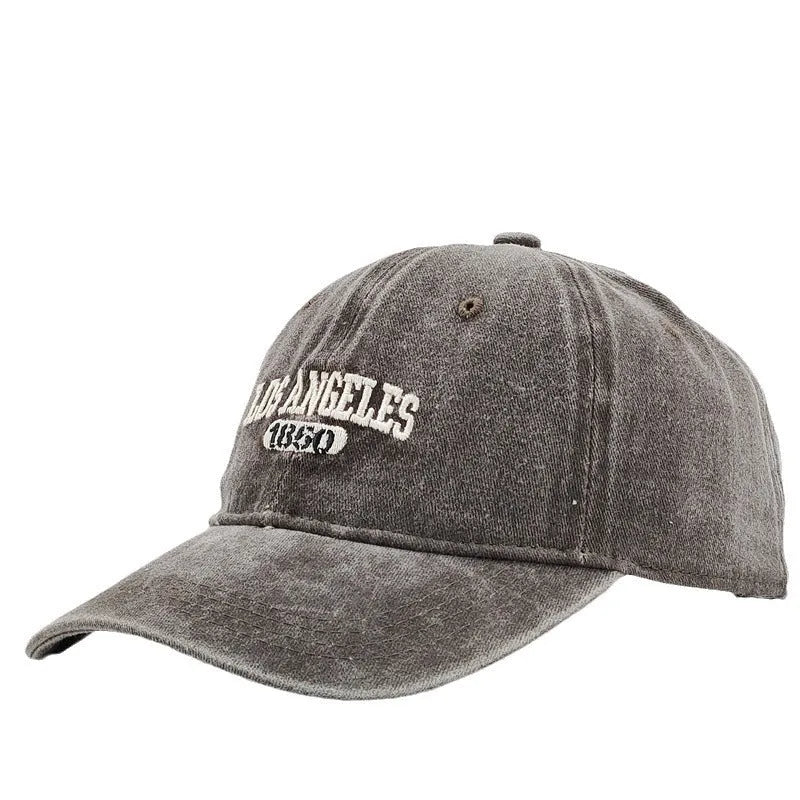 Retro personalised peaked cap with letters embroidery in beige, adjustable strap visible.