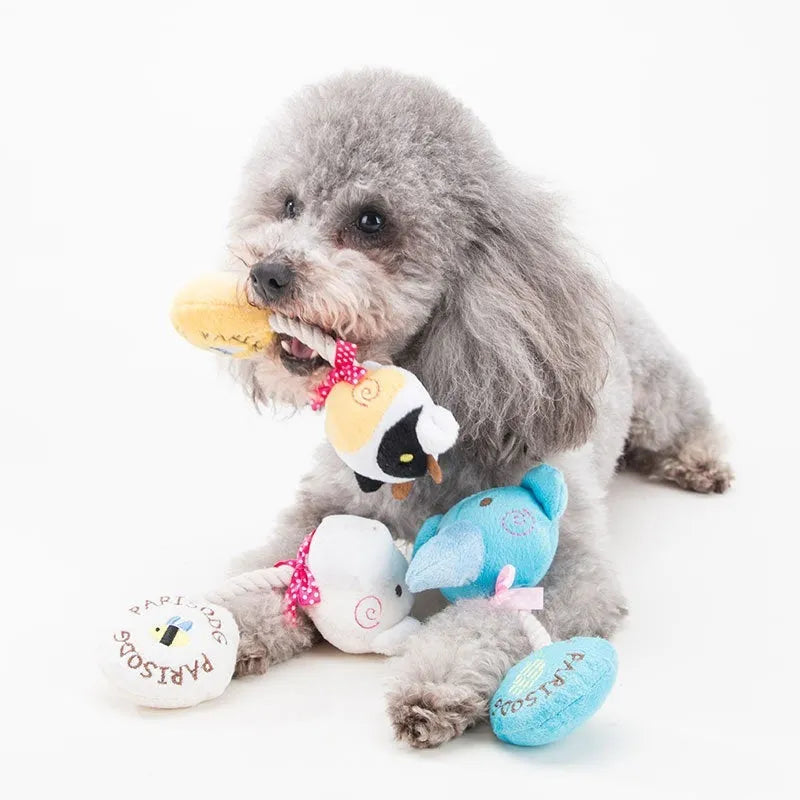 Plush dog toy with cotton rope and sound device in animal designs
