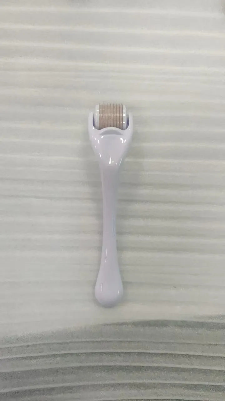540 micro needle derma roller with black handle and purple wheel, showing adjustable needle sizes.