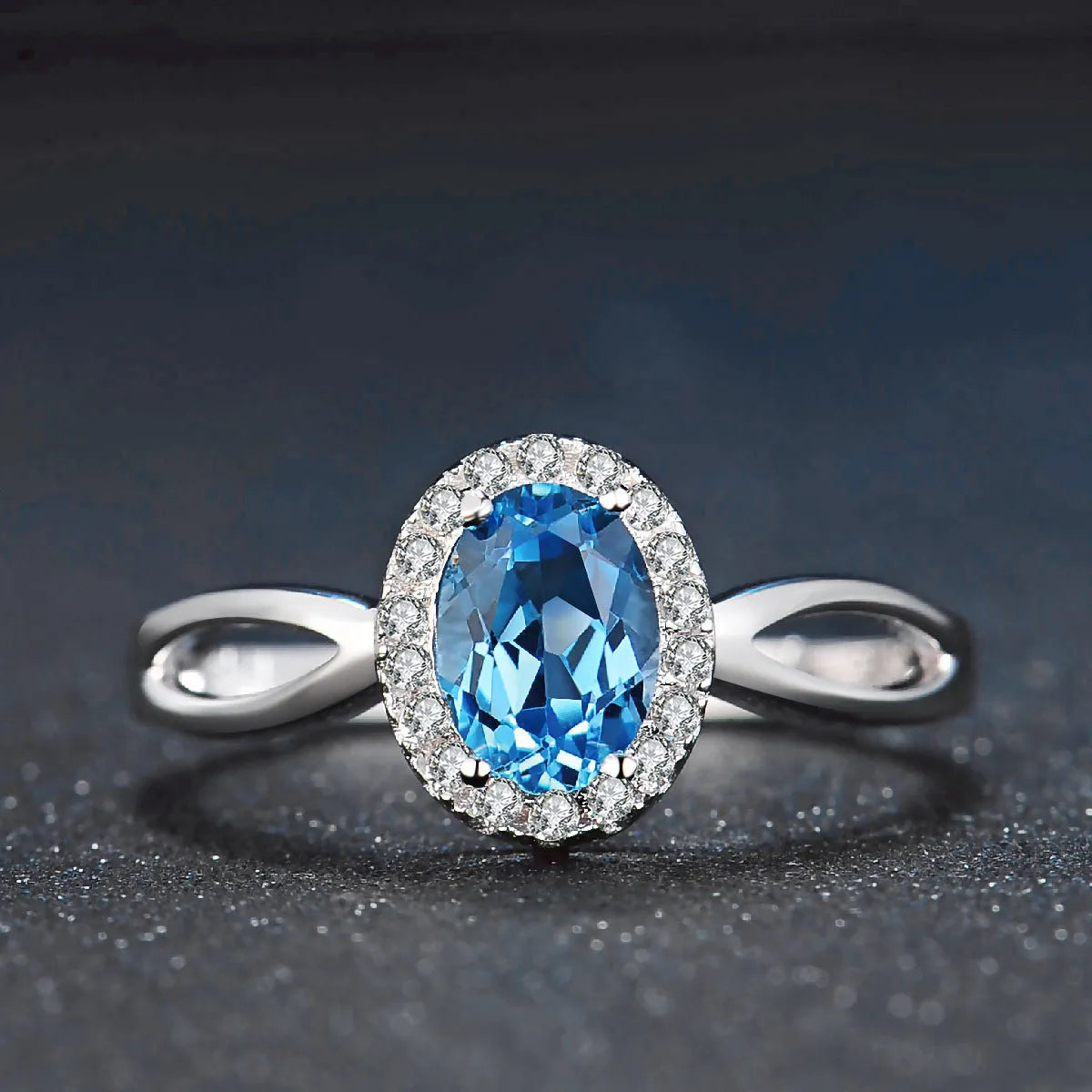 925 Sterling Silver four-piece jewellery set with Blue Topaz gemstones including earrings, ring, pendant and necklace