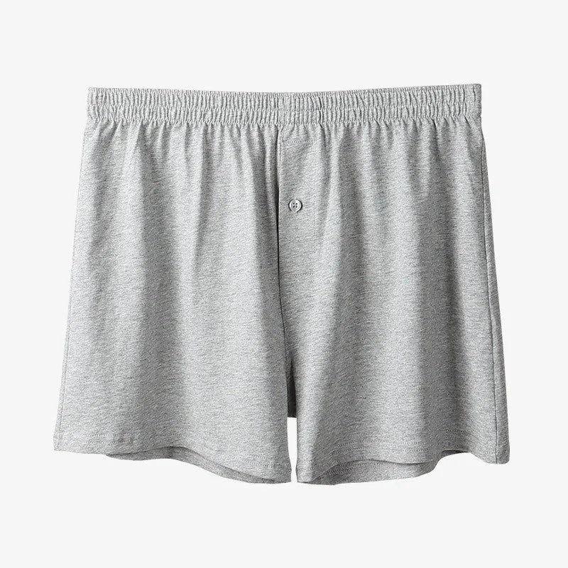 Men's solid colour cotton boxer shorts on a white background, showing loose fit and high waistband.