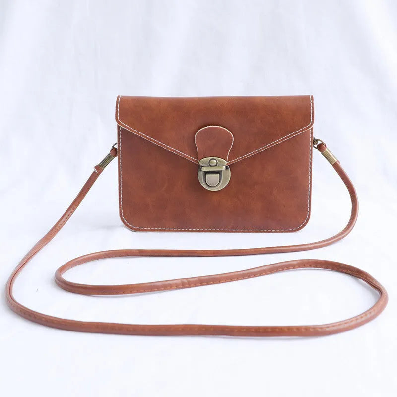 Retro shoulder messenger bag in wine red with flap closure and crossbody strap