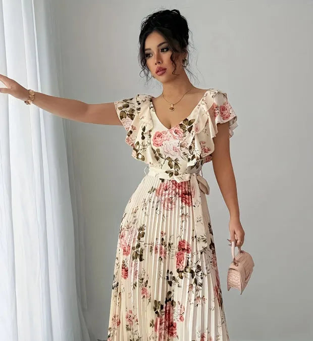 Apricot floral print women's dress with V-neck, ruffle sleeves, and a high-waisted swing skirt.