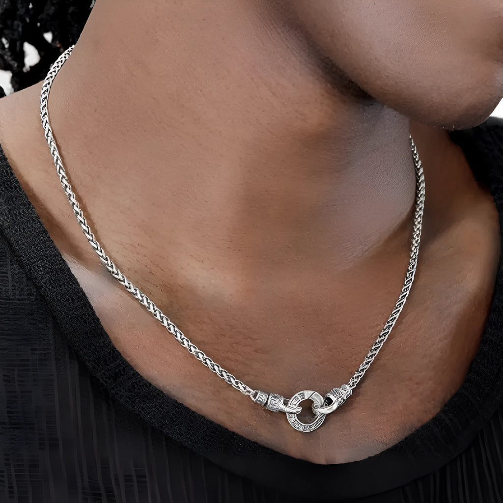A woman's S925 sterling silver clavicle necklace with a small polished pendant on a choice of 50cm, 55cm, or 60cm chain.