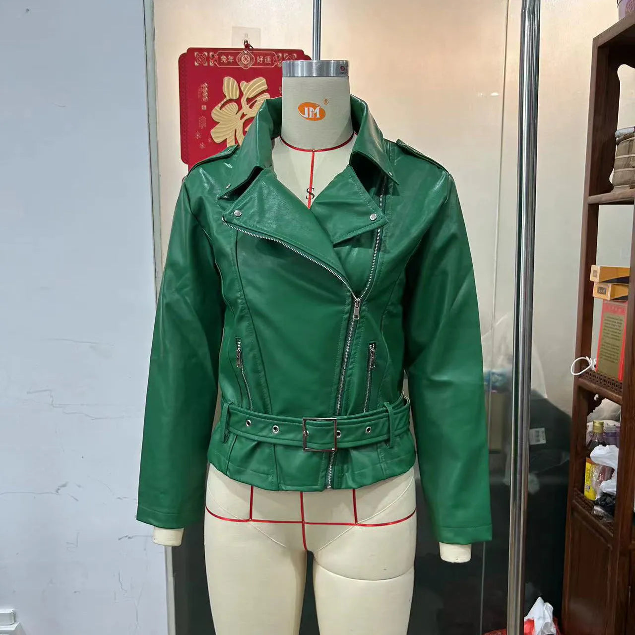 Punk style short belt lapel locomotive jacket in polyester leather, available in black, blue, and green.