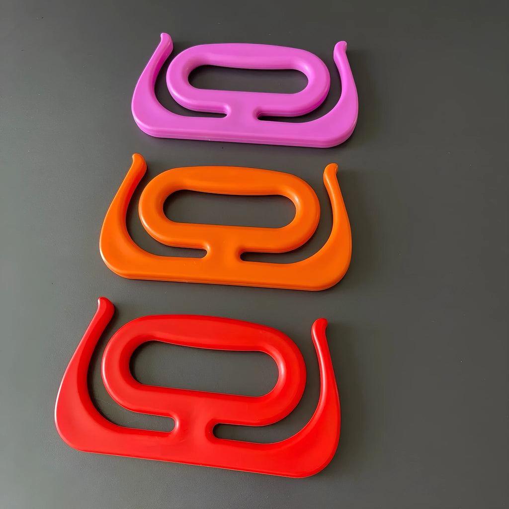Plastic storage bag handle rack in black, 17.3 x 9.2 cm, with bag handles attached