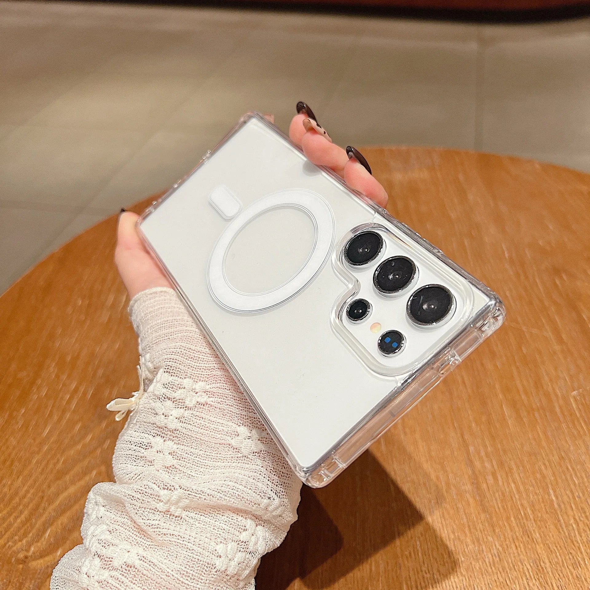 Clear magnetic silicone phone case on a Samsung smartphone showing transparent design and all-inclusive coverage.