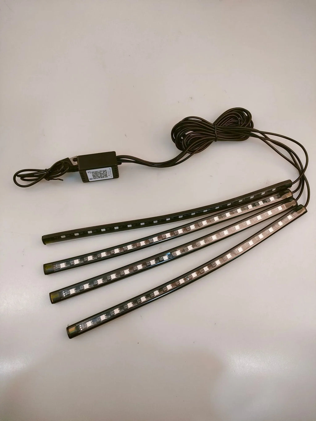 Universal car footwell LED atmosphere light strip with voice and app control for eight colours.