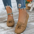 Women's casual flat shoes with bow detail in suede, shown in a solid colour.