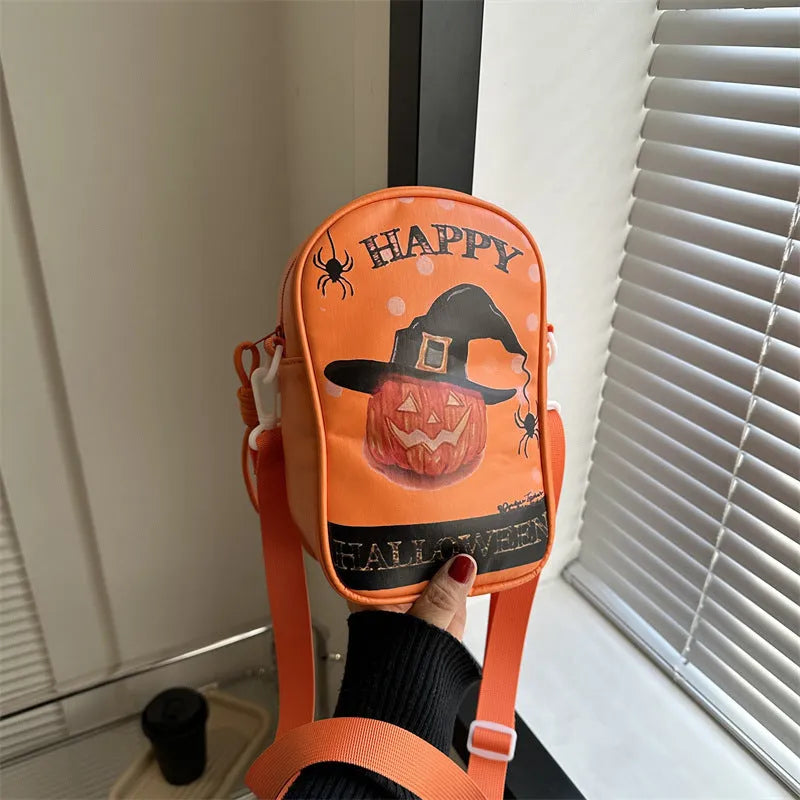 Halloween graffiti print crossbody phone bag with cartoon pumpkins, in multiple colours.