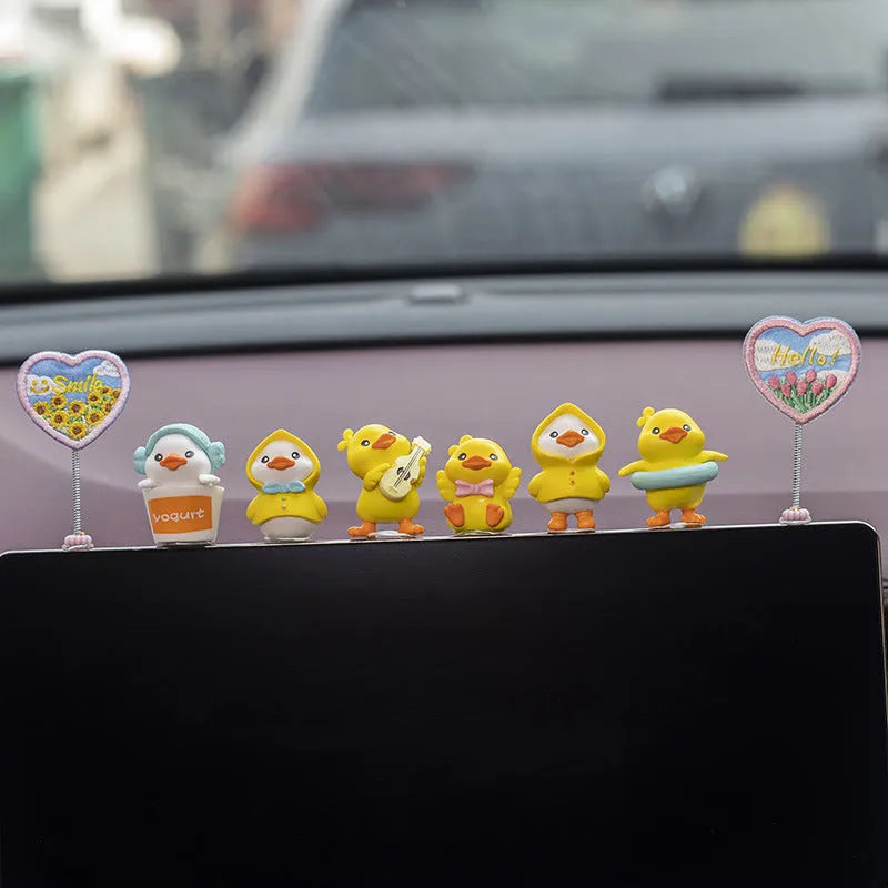 PVC cartoon duckling car decoration set with six small ducks and one hello welcome sign.