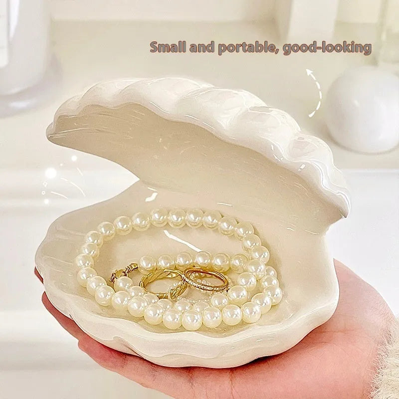 White porcelain storage tray holding a small night light, in yellow, pink, or white colour.